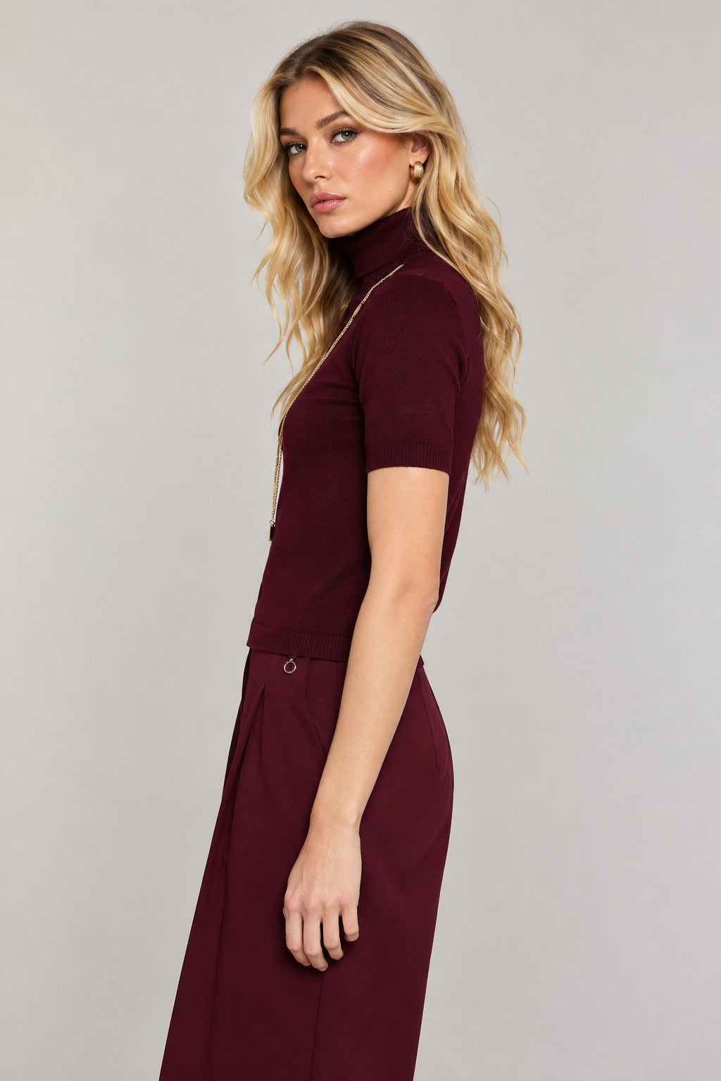 paired with burgundy wide-leg pants for autumn look